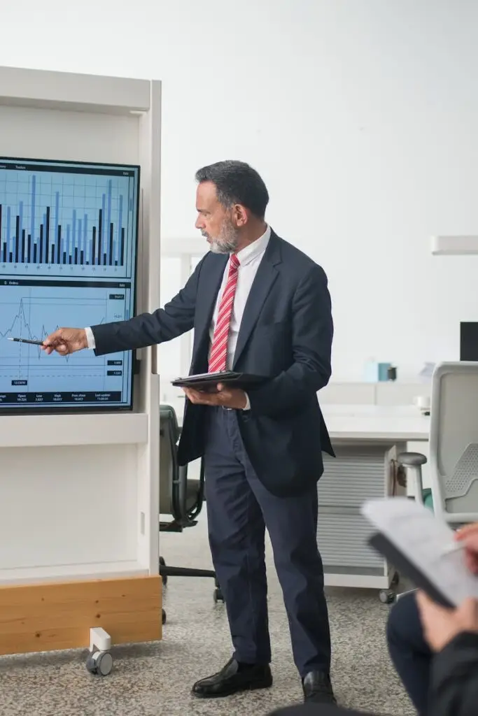 Professional conducts data analysis presentation in a modern office setting.